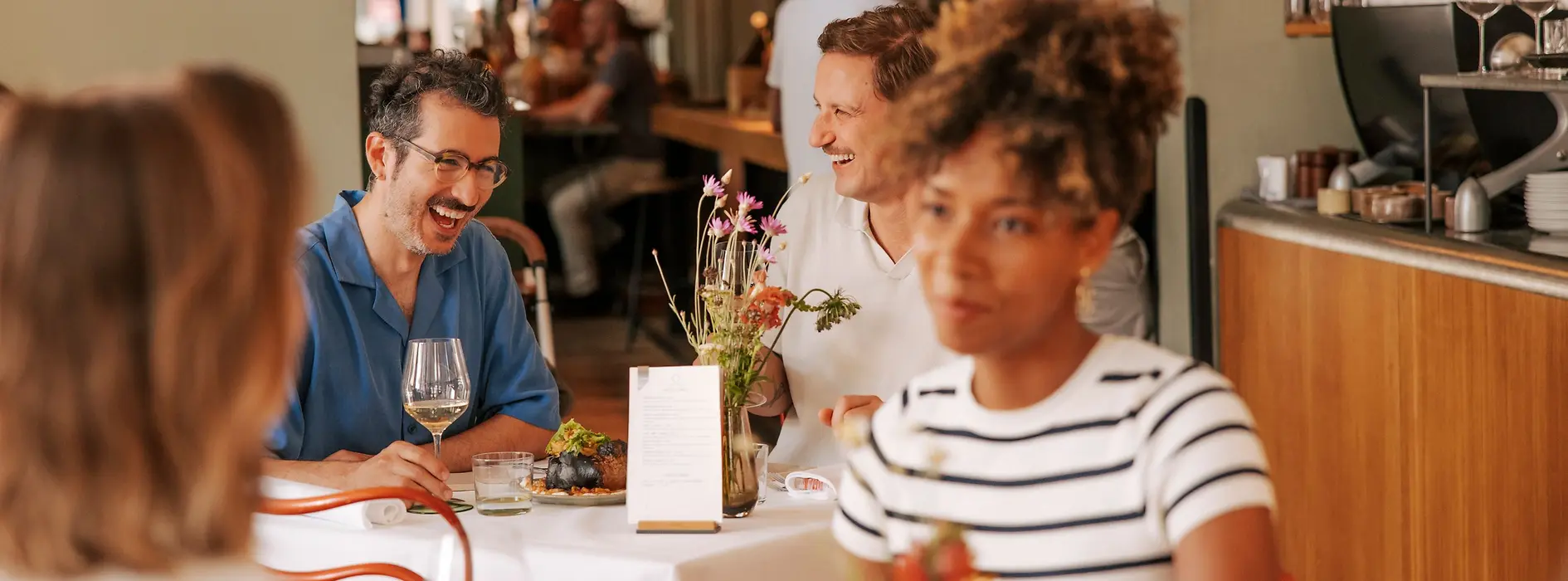 Guests eating and drinking at a restaurant