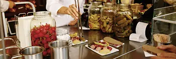 woman preparing sausage