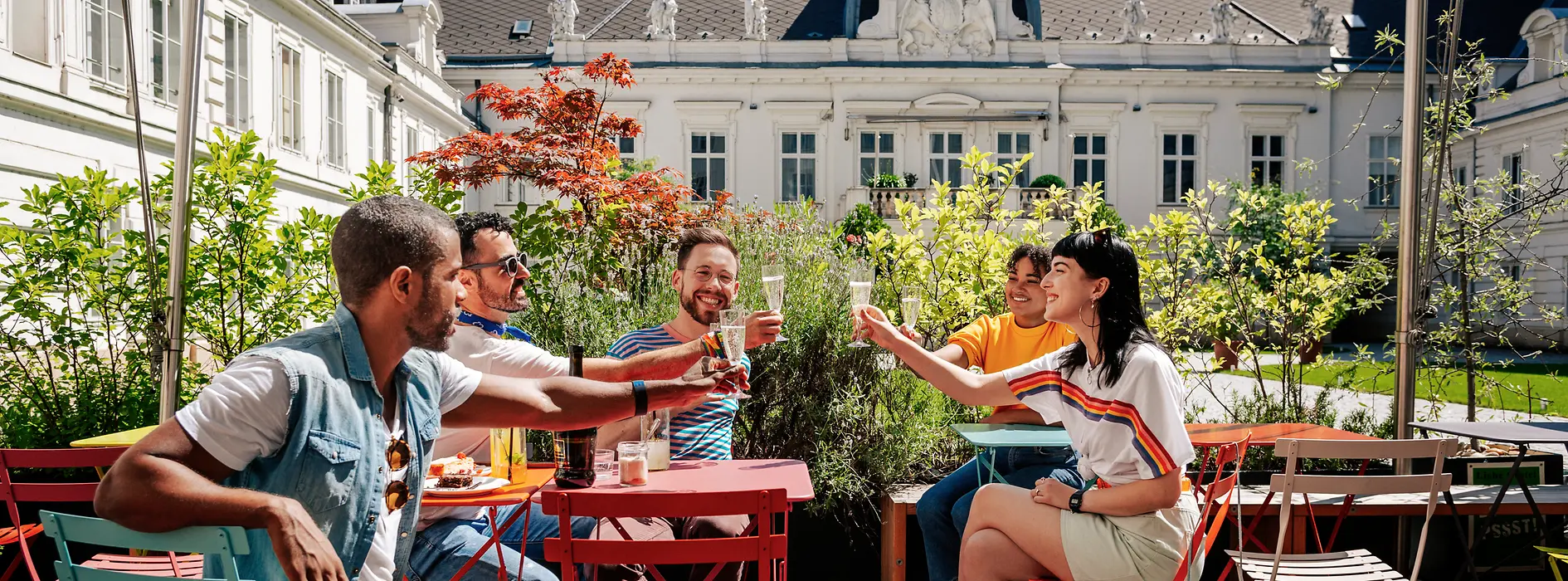 Group of young people drinking together in a sidewalk café