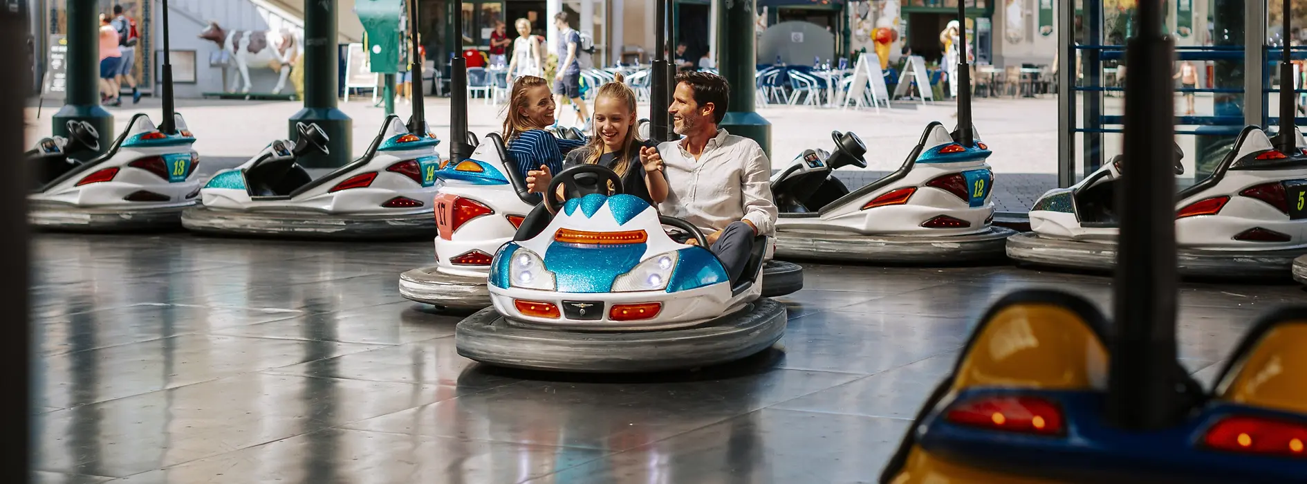 Family riding the autodrome in the Prater