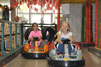 Family Fun, two girls in scooters