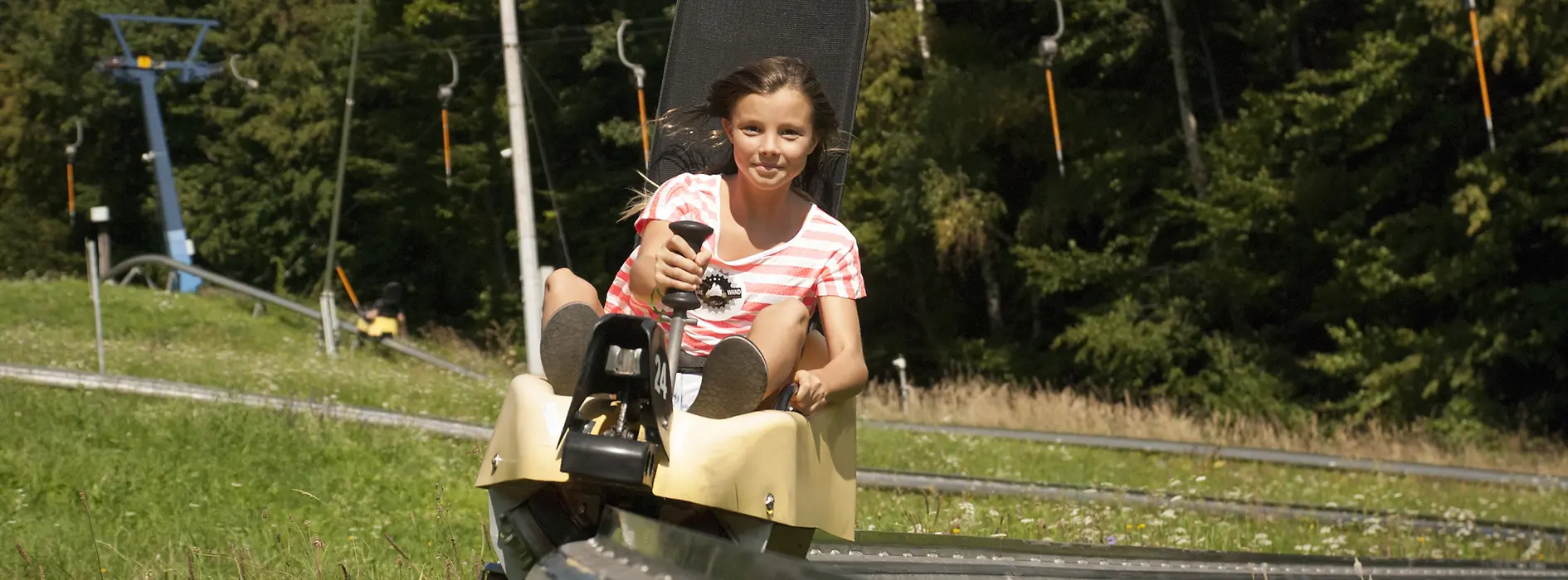 Girl speeding down the toboggan