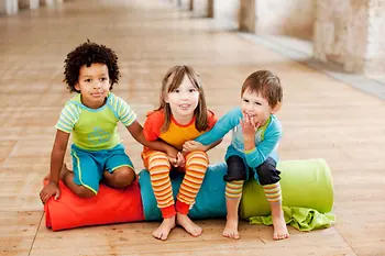 Three children in colorful clothing