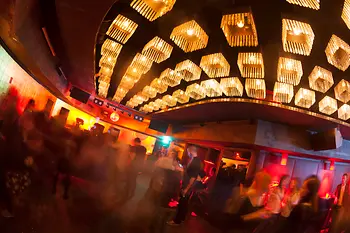 Sass, interior shot with a view toward the dance floor and guests 