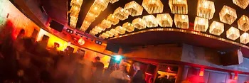 Sass, interior shot with a view toward the dance floor and guests 