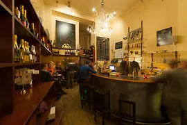 Szigeti champagne bar, interior view showing the bar and the lounge with guests