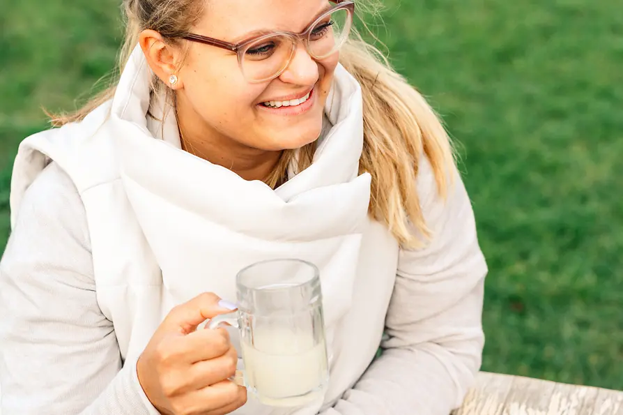 Hiking, woman drinking young wine