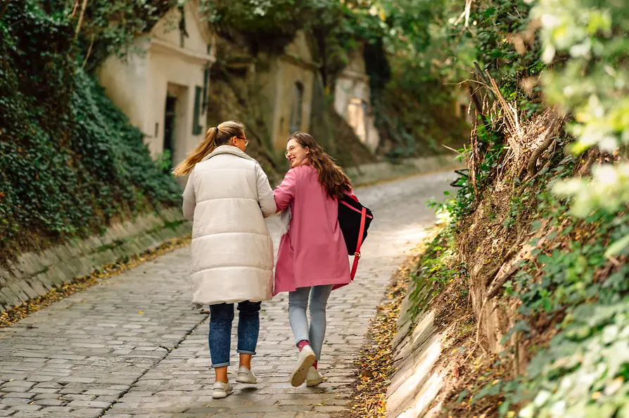 Hiking, two women in a cellar alley