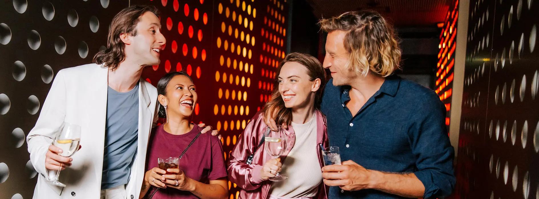 People in a disco with glasses in their hands