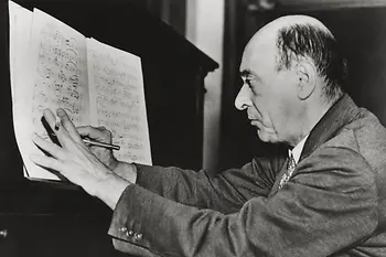 Arnold Schönberg writing notes on a sheet of paper, Los Angeles, ca. 1935