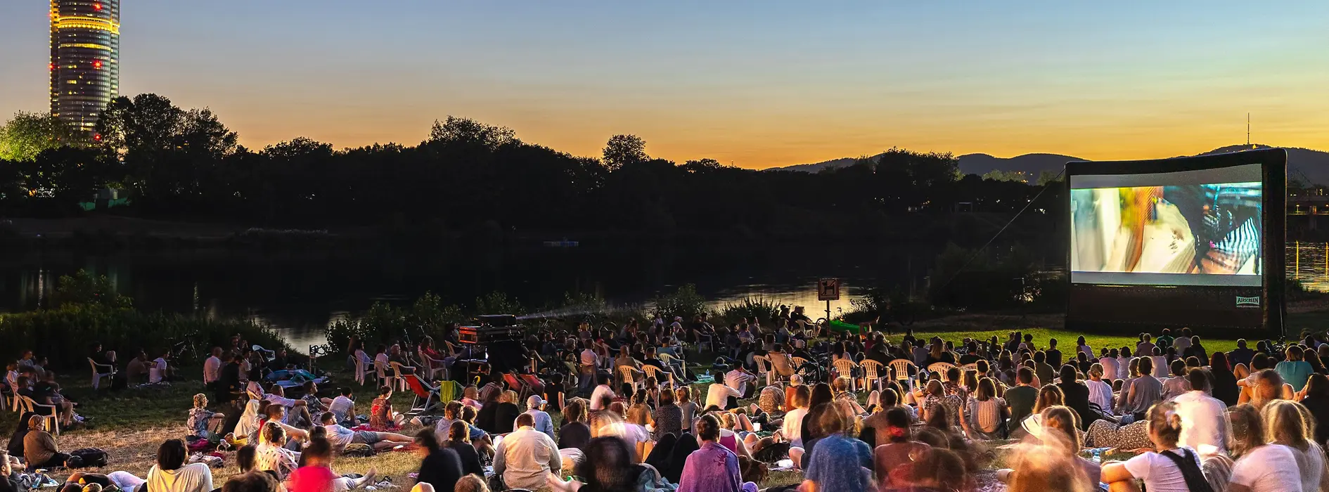 Open-air cinema in a Viennese park at night