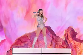 Taylor Swift live on stage wearing a glitter outfit