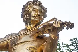 Johann Strauss monument in the city park in winter