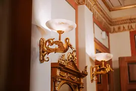 Close-up of two classicist lamps in the Great Hall of the Musikverein