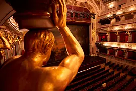 MusikTheater an der Wien, view of the stage behind a caryatid (column in the shape of a human figure)