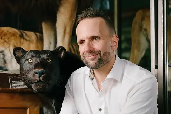 Museum of Natural History Vienna: employee Wilhelm Lubenik next to a stuffed jaguar